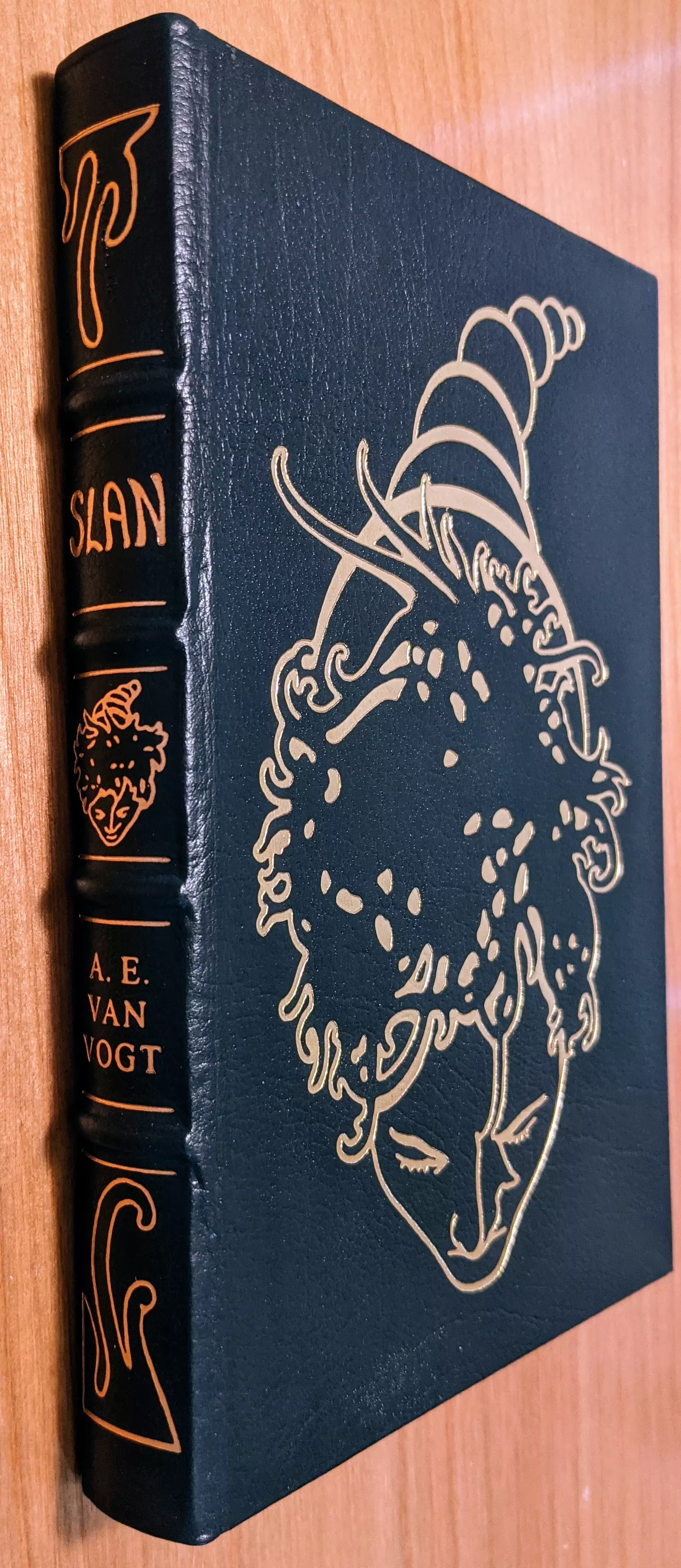 Stunning Dark Navy Blue Leather Bound hardback book with hubbed spine, cover artwork in 22kt gold, printed on archival paper with gold gilded edges, smyth sewing & concealed muslin joints
	  - original artwork by Richard Powers