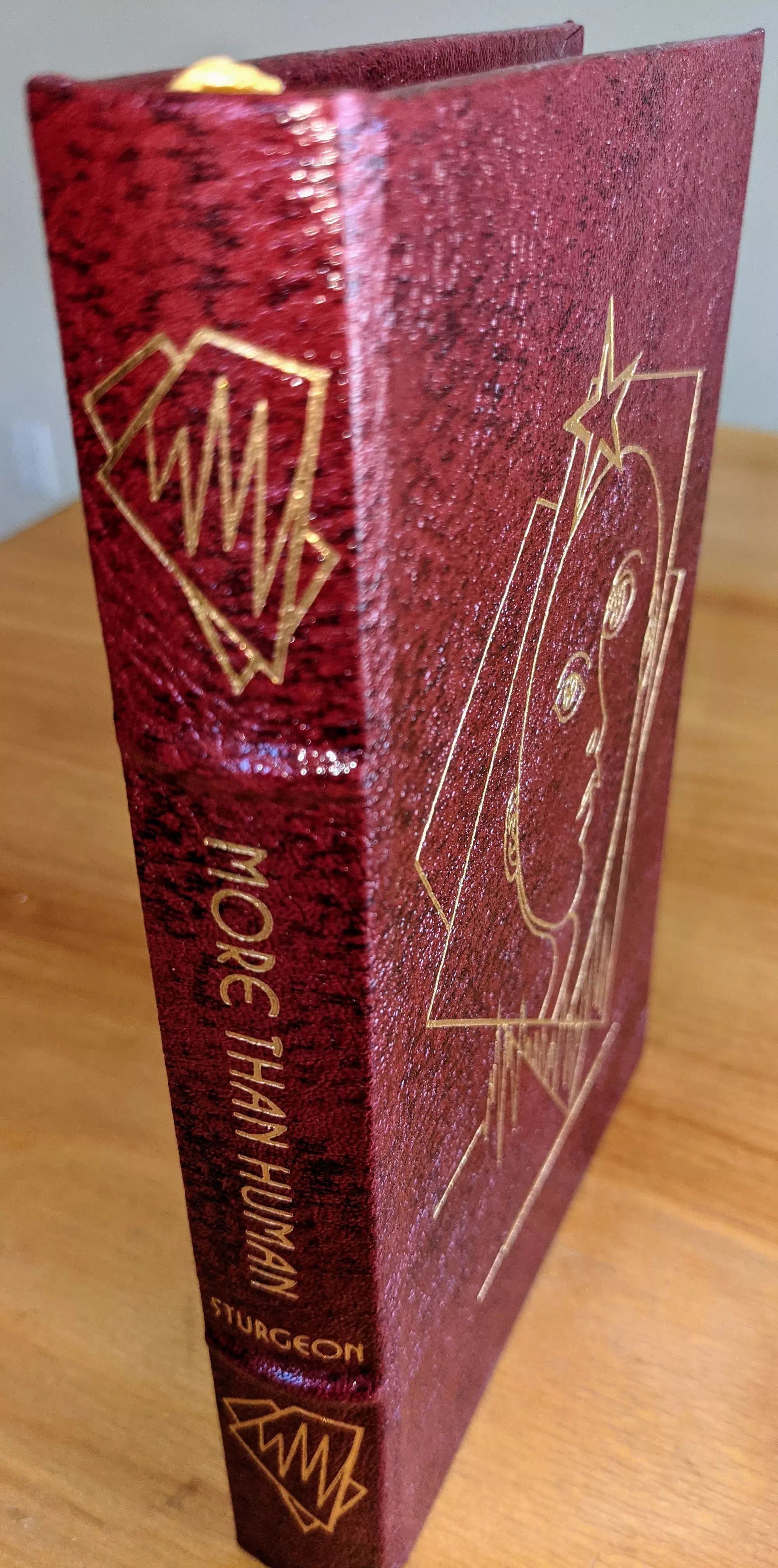 Stunning Red & Black Leather Bound hardback book with hubbed spine, cover artwork in 22kt gold, printed on archival paper with gold gilded edges, smyth sewing & concealed muslin joints
	  - original artwork by Jeff Fisher