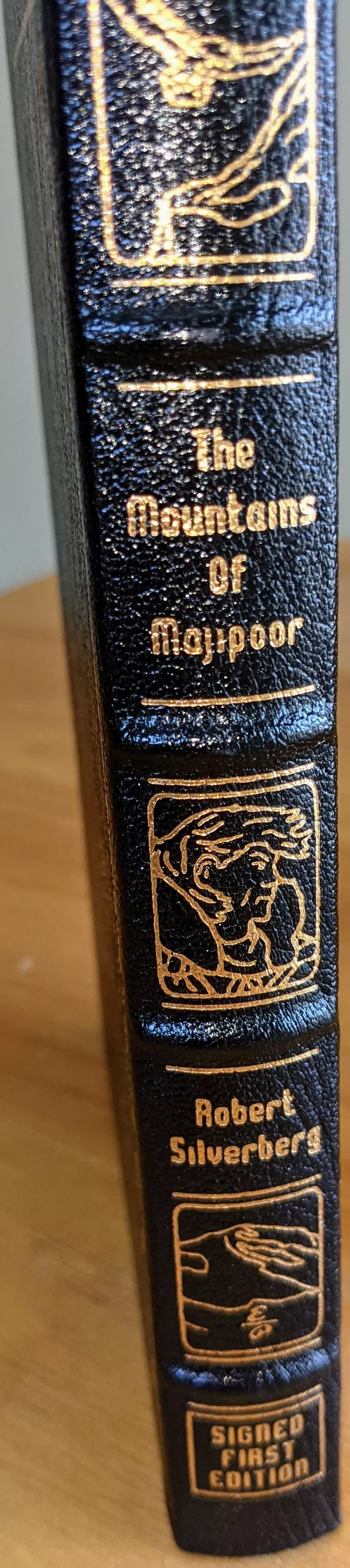 Stunning Black Leather Bound hardback book with hubbed spine, cover artwork in 22kt gold, printed on archival paper with gold gilded edges, smyth sewing & concealed muslin joints
	  - original artwork by Ron Miller