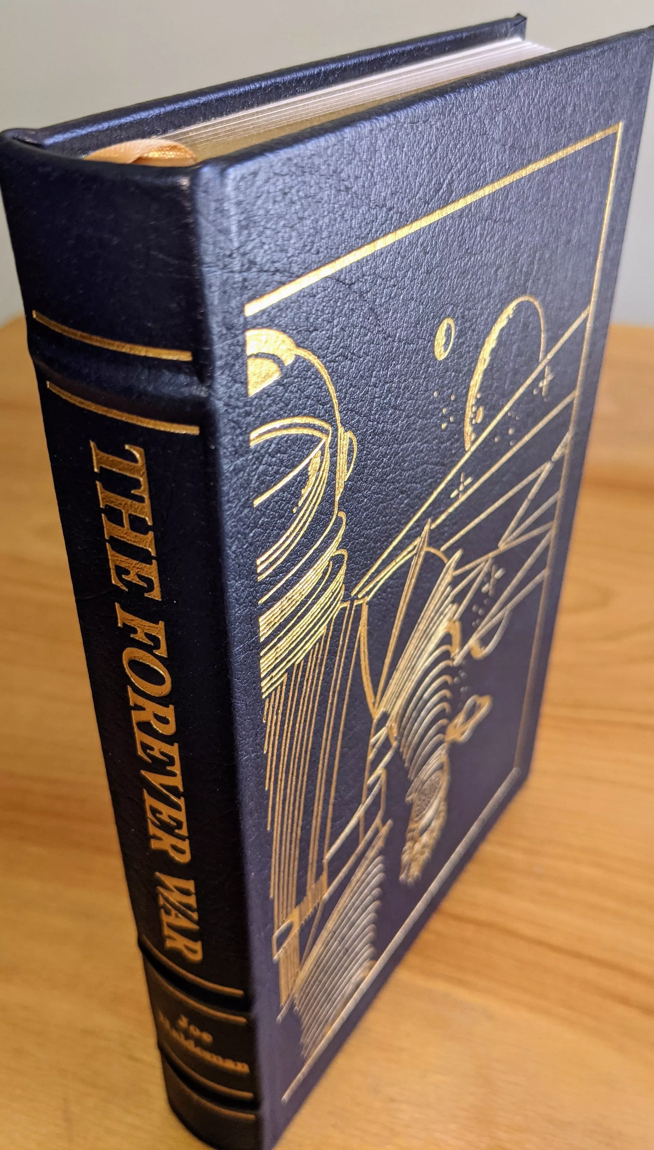 Stunning Blue Leather Bound hardback book with hubbed spine, cover artwork in 22kt gold, printed on archival paper with gold gilded edges, smyth sewing & concealed muslin joints
	  - original artwork by Vincent DiFate