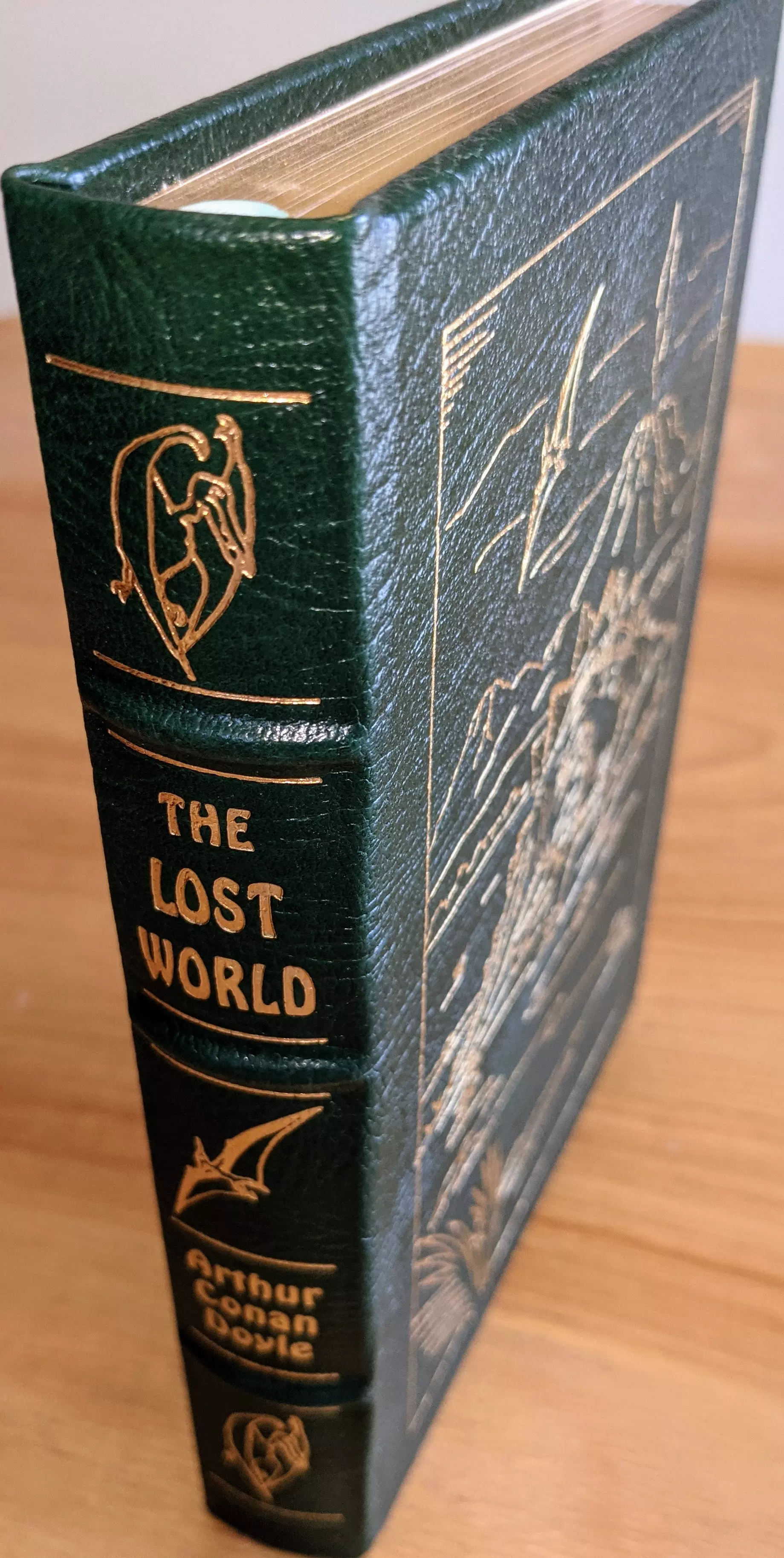 Stunning Green Leather Bound hardback book with hubbed spine, cover artwork in 22kt gold, printed on archival paper with gold gilded edges, smyth sewing & concealed muslin joints
	  - original artwork by Jeff Fisher