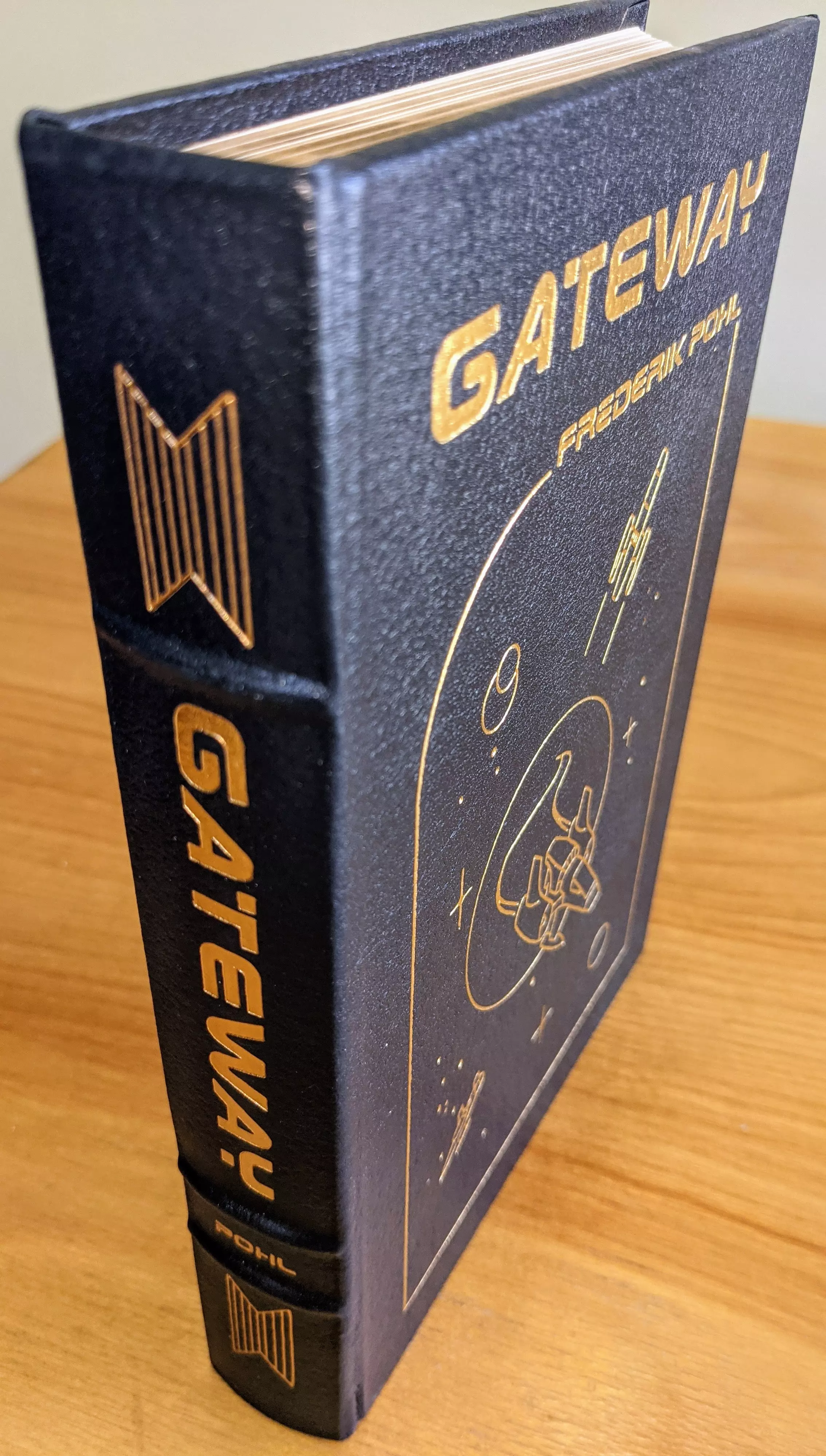 Stunning Dark Navy Blue Leather Bound hardback book with hubbed spine, cover artwork in 22kt gold, printed on archival paper with gold gilded edges, smyth sewing & concealed muslin joints
	  - original artwork by Vincent DiFate