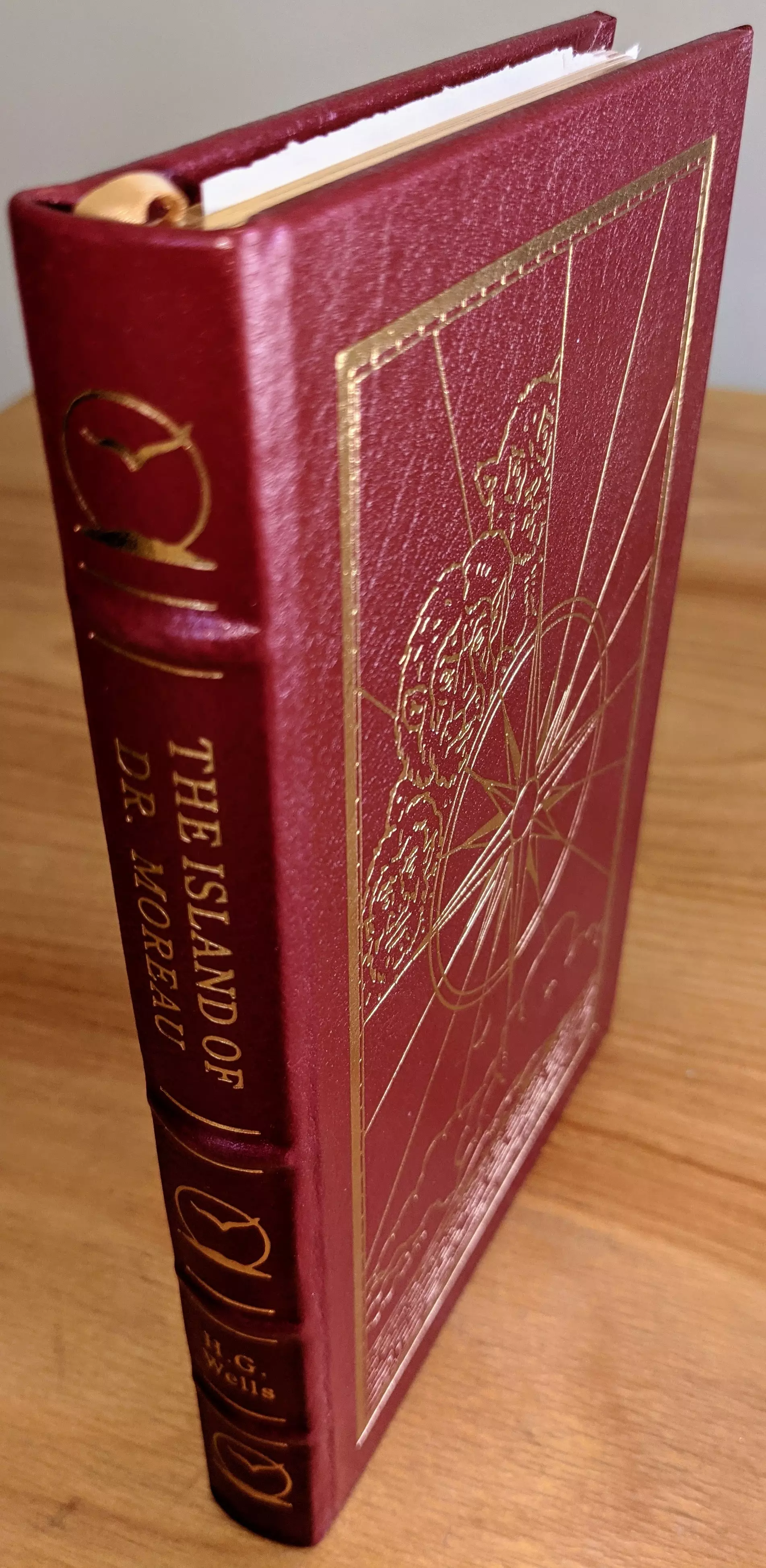 Stunning Red Leather Bound hardback book with hubbed spine, cover artwork in 22kt gold, printed on archival paper with gold gilded edges, smyth sewing & concealed muslin joints
	  - original artwork by Jeff Fisher
