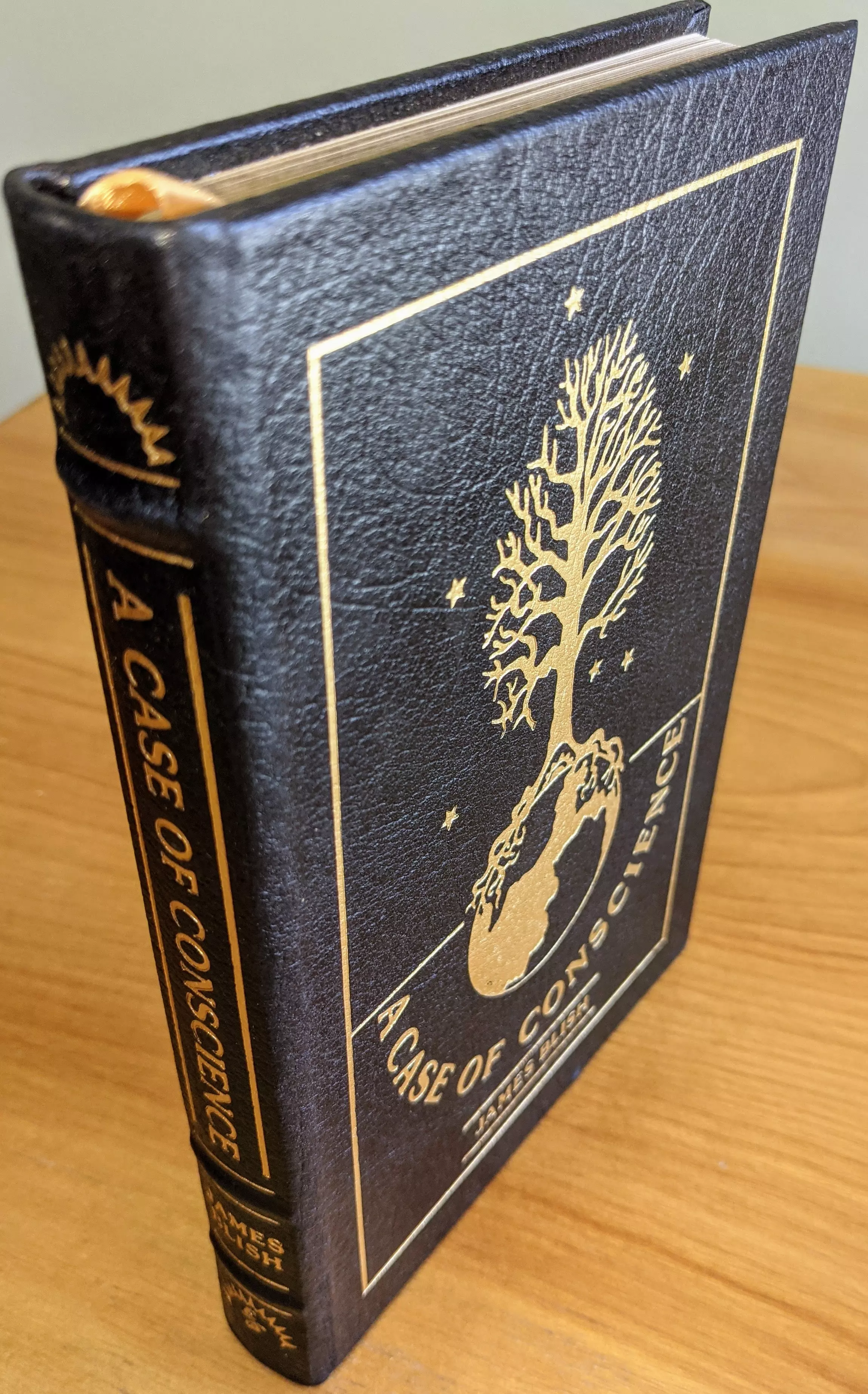 Stunning Black Leather Bound hardback book with hubbed spine, cover artwork in 22kt gold, printed on archival paper with gold gilded edges, smyth sewing & concealed muslin joints
	  - original artwork by Ellen Sull Farley
