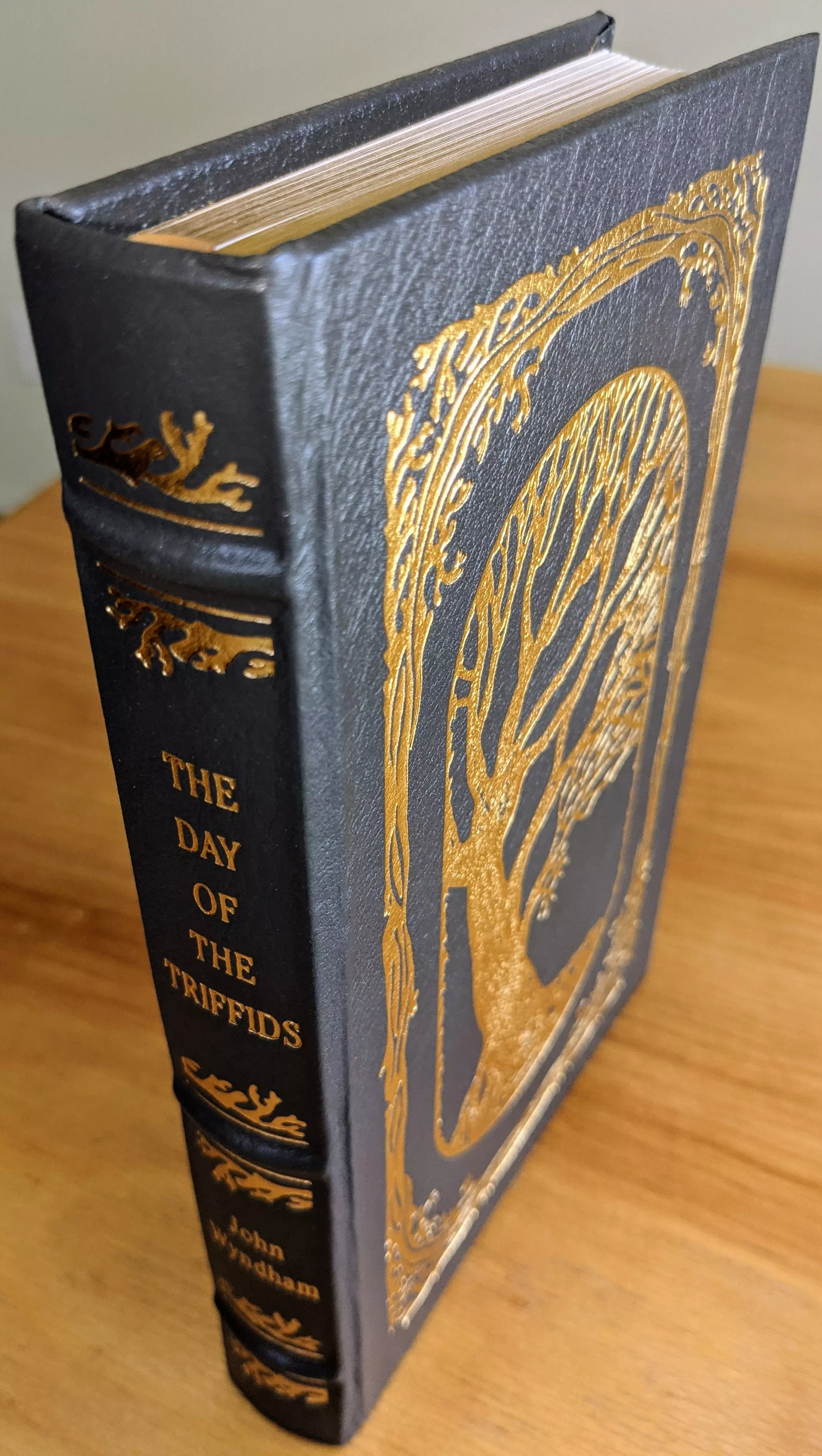 Stunning Blue Leather Bound hardback book with hubbed spine, cover artwork in 22kt gold, printed on archival paper with gold gilded edges, smyth sewing & concealed muslin joints
	  - original artwork by Richard Powers