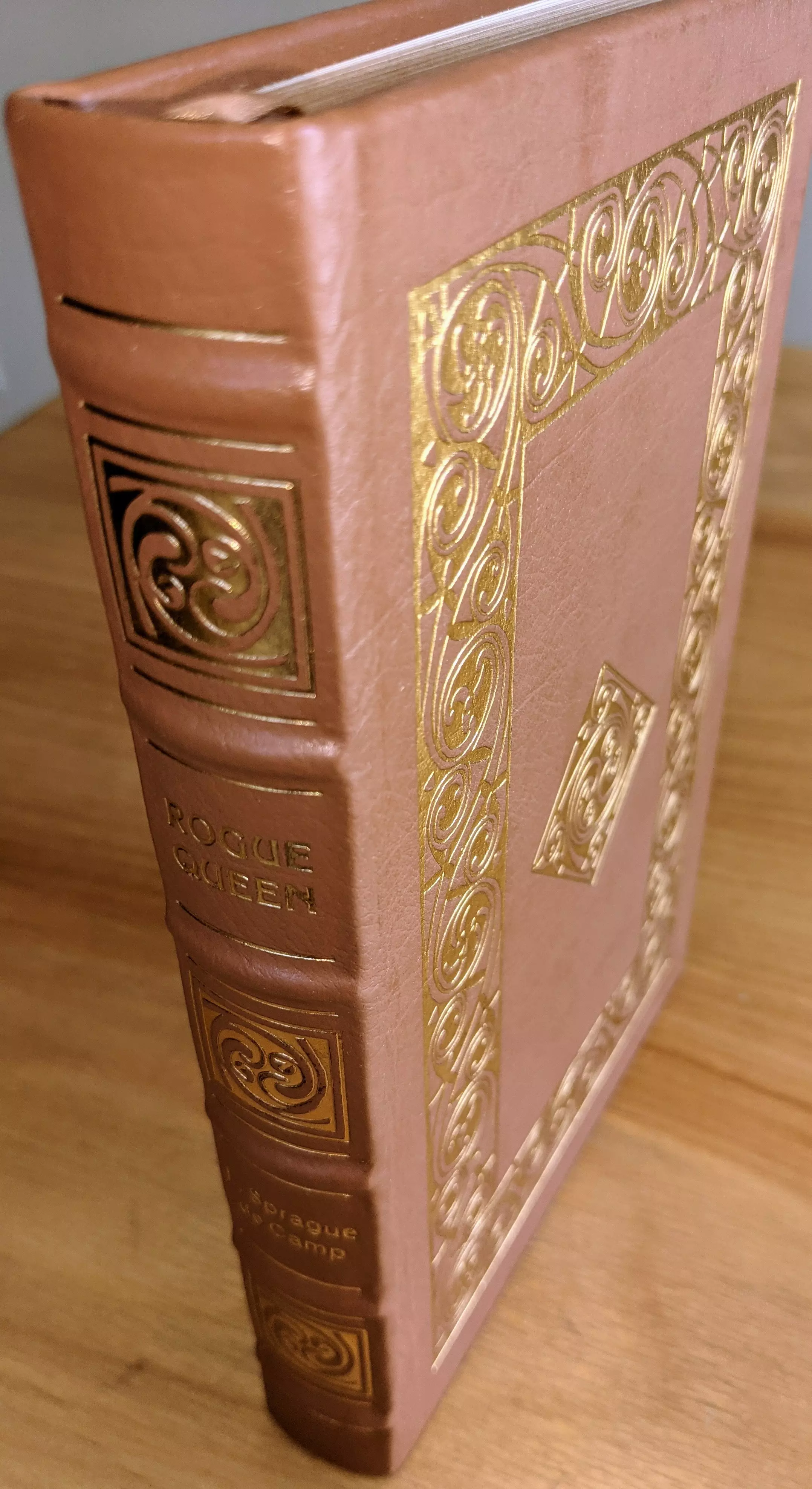 Stunning Tan Leather Bound hardback book with hubbed spine, cover artwork in 22kt gold, printed on archival paper with gold gilded edges, smyth sewing & concealed muslin joints
	  - original artwork by Jill Bauman