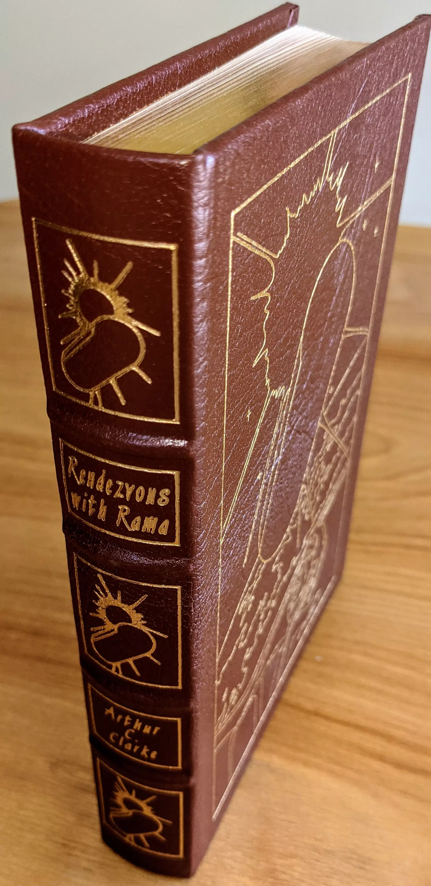 Stunning Brown Leather Bound hardback book with hubbed spine, cover artwork in 22kt gold, printed on archival paper with gold gilded edges, smyth sewing & concealed muslin joints
	  - original artwork by Bob Eggleton