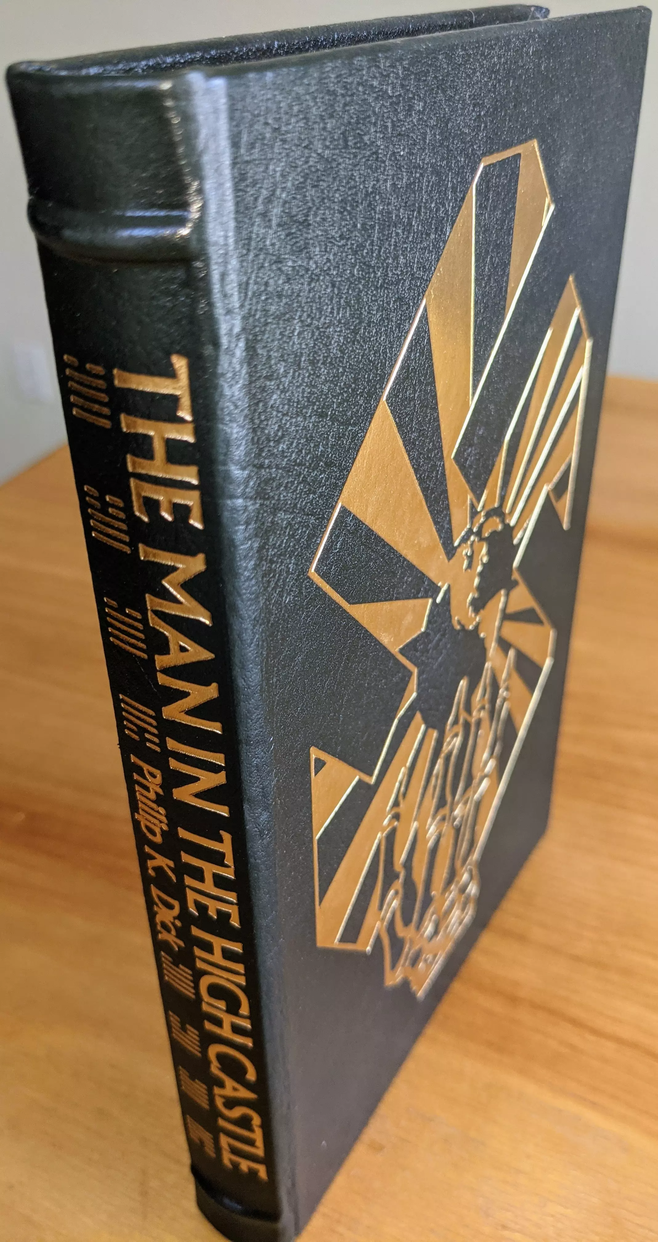Stunning Dark Green Leather Bound hardback book with hubbed spine, cover artwork in 22kt gold, printed on archival paper with gold gilded edges, smyth sewing & concealed muslin joints
	  - original artwork by Richard Powers