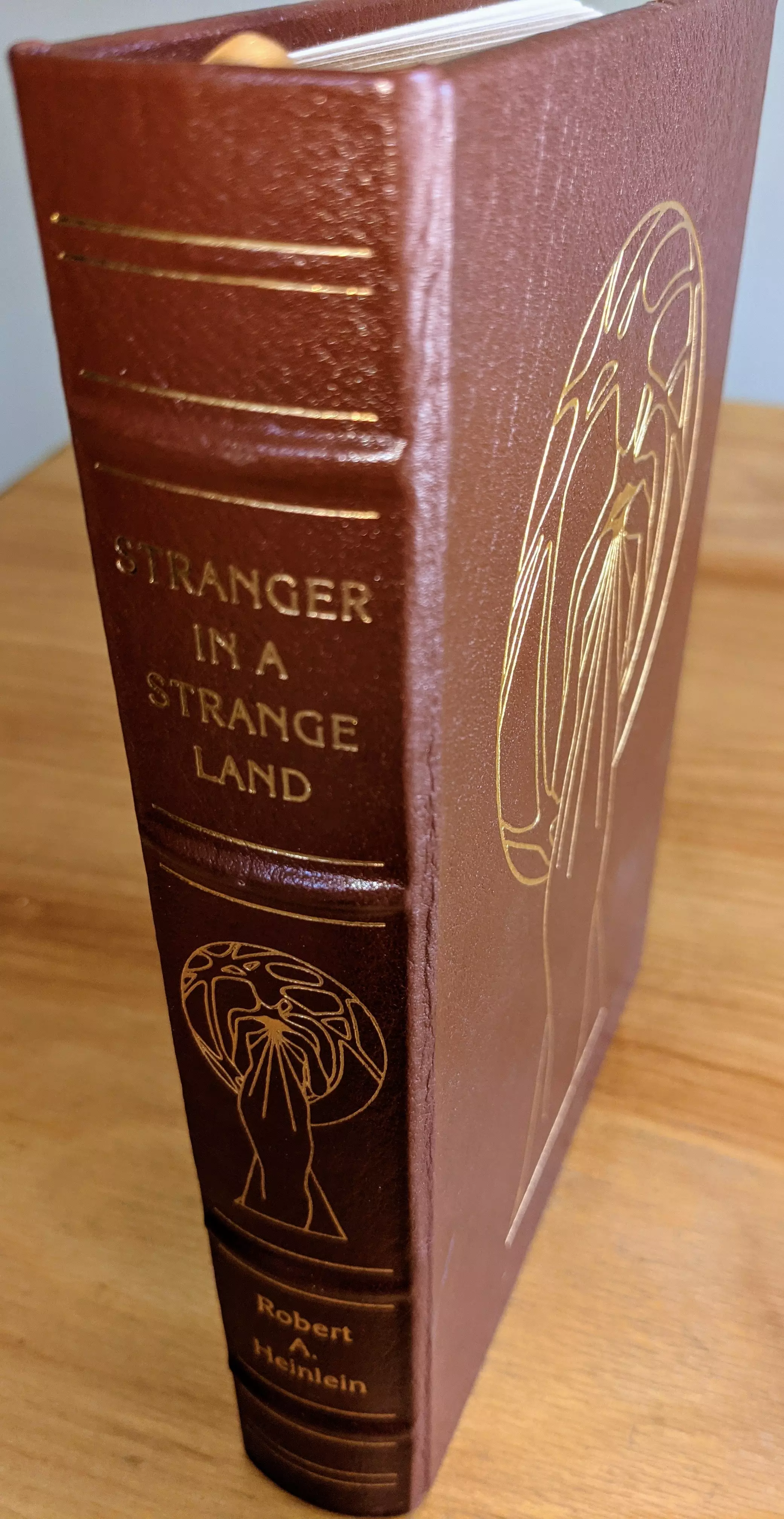 Stunning Brown Leather Bound hardback book with hubbed spine, cover artwork in 22kt gold, printed on archival paper with gold gilded edges, smyth sewing & concealed muslin joints
	  - original artwork by Kent Bash