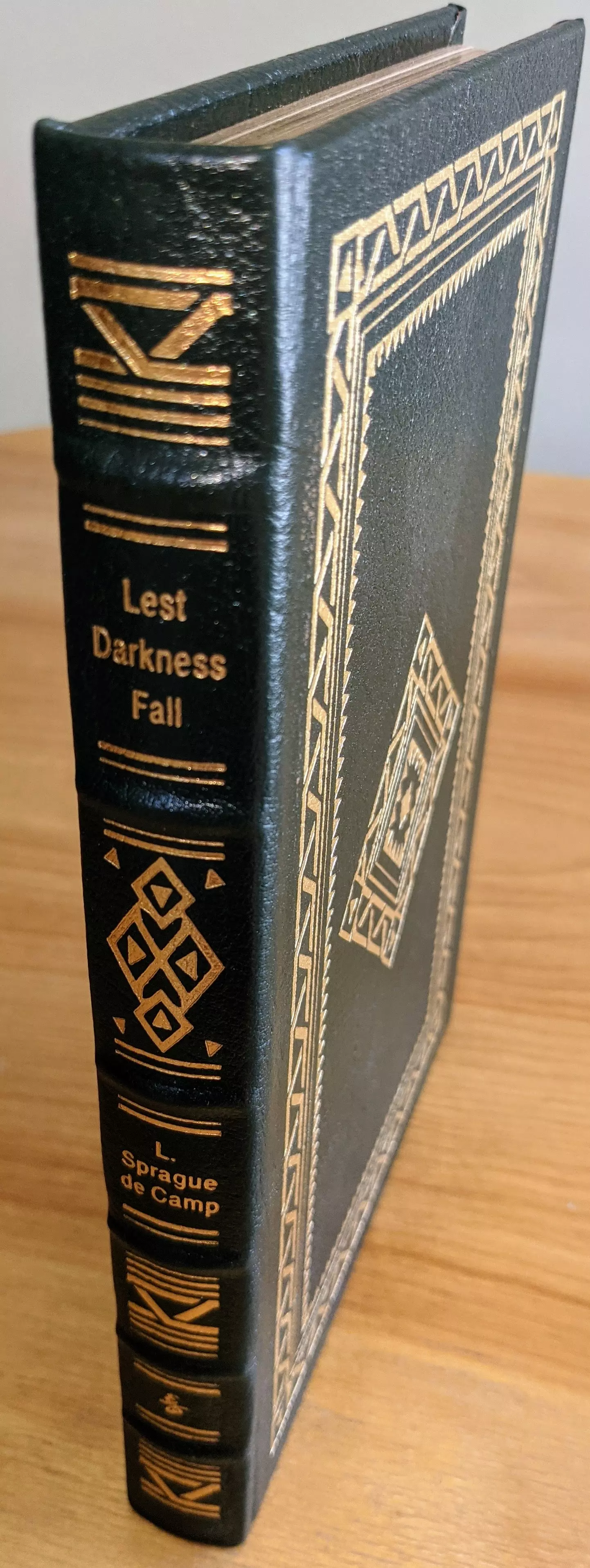 Stunning Dark Green Leather Bound hardback book with hubbed spine, cover artwork in 22kt gold, printed on archival paper with gold gilded edges, smyth sewing & concealed muslin joints
	  - original artwork by Pat Morrissey