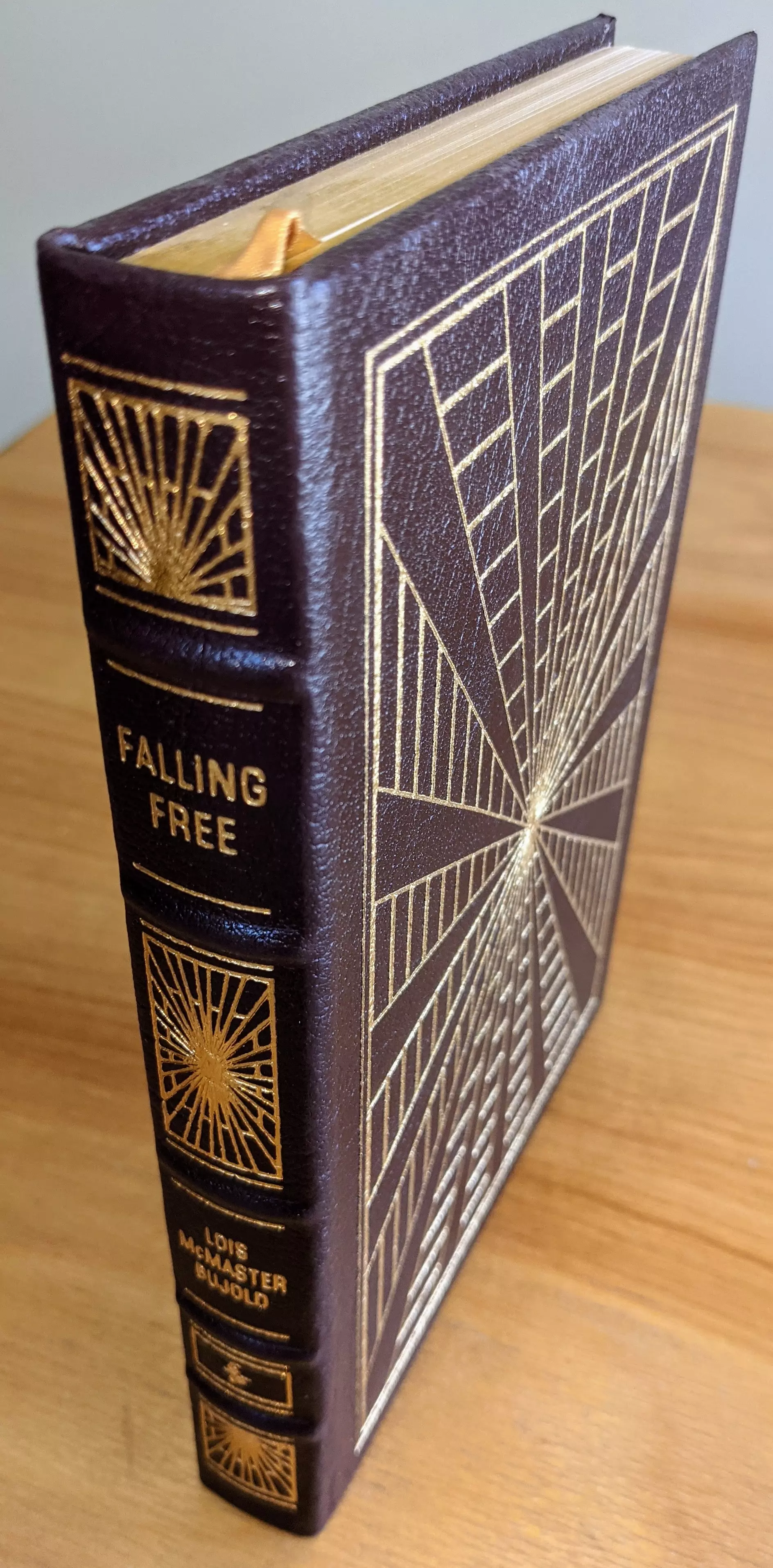 Stunning Dark Wine Leather Bound hardback book with hubbed spine, cover artwork in 22kt gold, printed on archival paper with gold gilded edges, smyth sewing & concealed muslin joints
	  - original artwork by Unknown