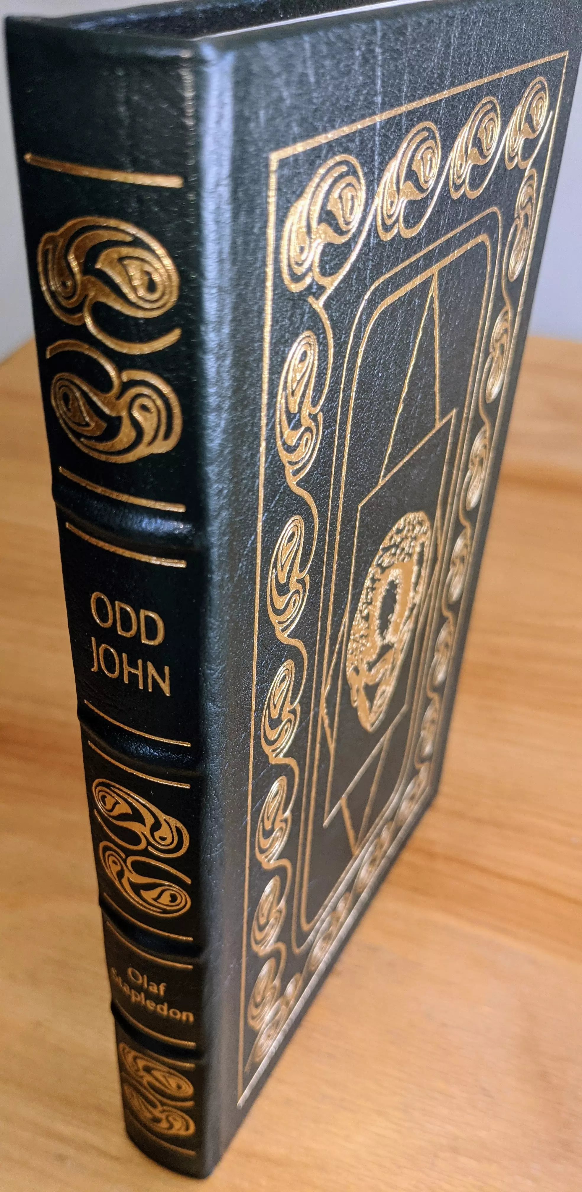 Stunning Dark Green Leather Bound hardback book with hubbed spine, cover artwork in 22kt gold, printed on archival paper with gold gilded edges, smyth sewing & concealed muslin joints
	  - original artwork by Wendy Snow-Lang