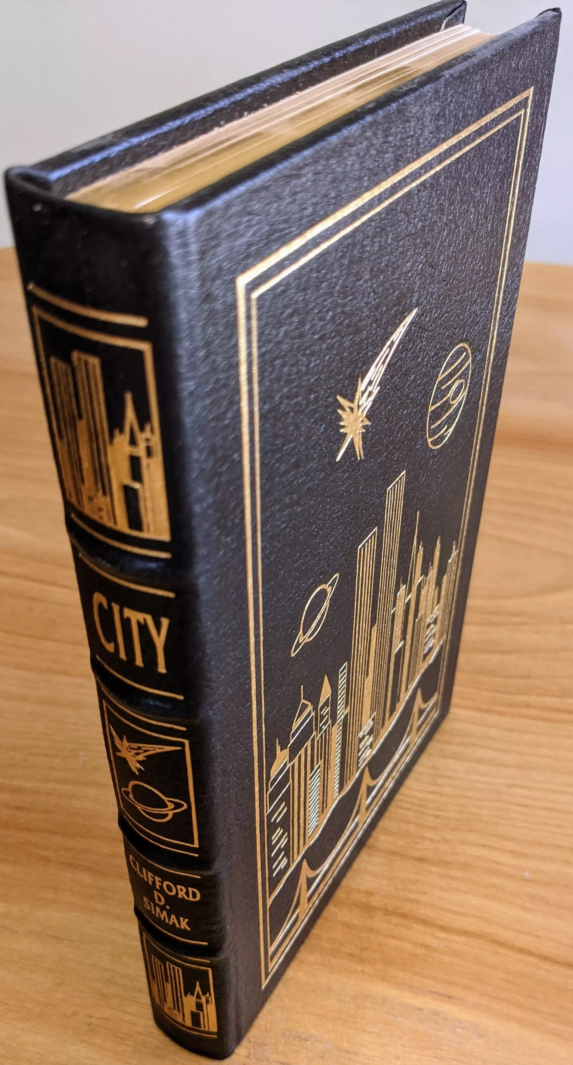 Stunning Black Leather Bound hardback book with hubbed spine, cover artwork in 22kt gold, printed on archival paper with gold gilded edges, smyth sewing & concealed muslin joints
	  - original artwork by Pat Morrissey