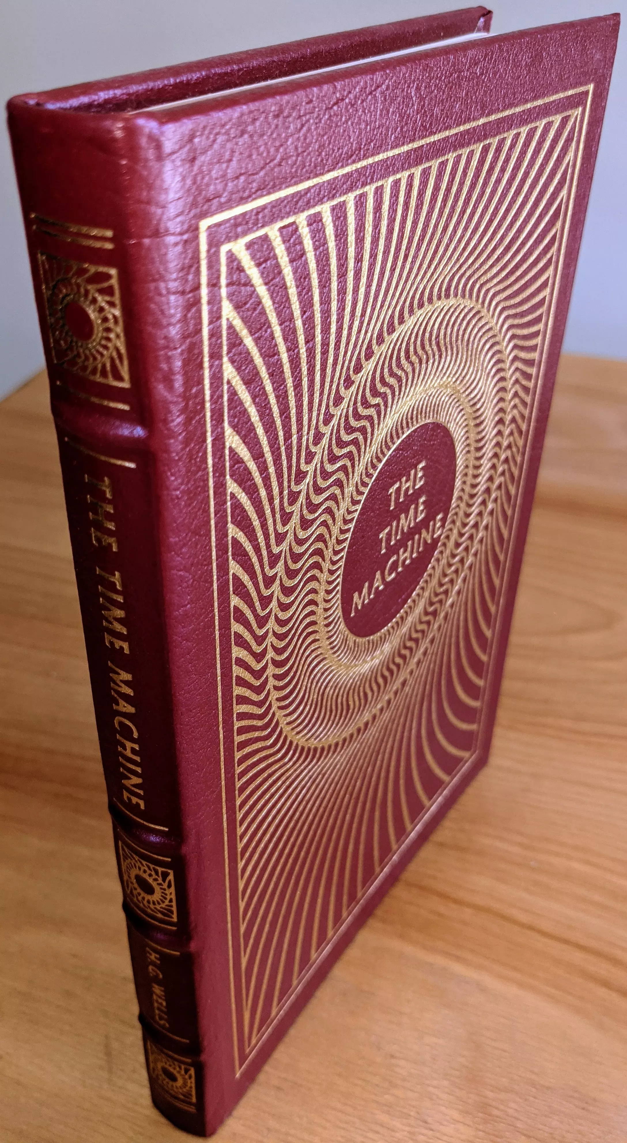 Stunning Red Leather Bound hardback book with hubbed spine, cover artwork in 22kt gold, printed on archival paper with gold gilded edges, smyth sewing & concealed muslin joints
	  - original artwork by Joe Mugnaini