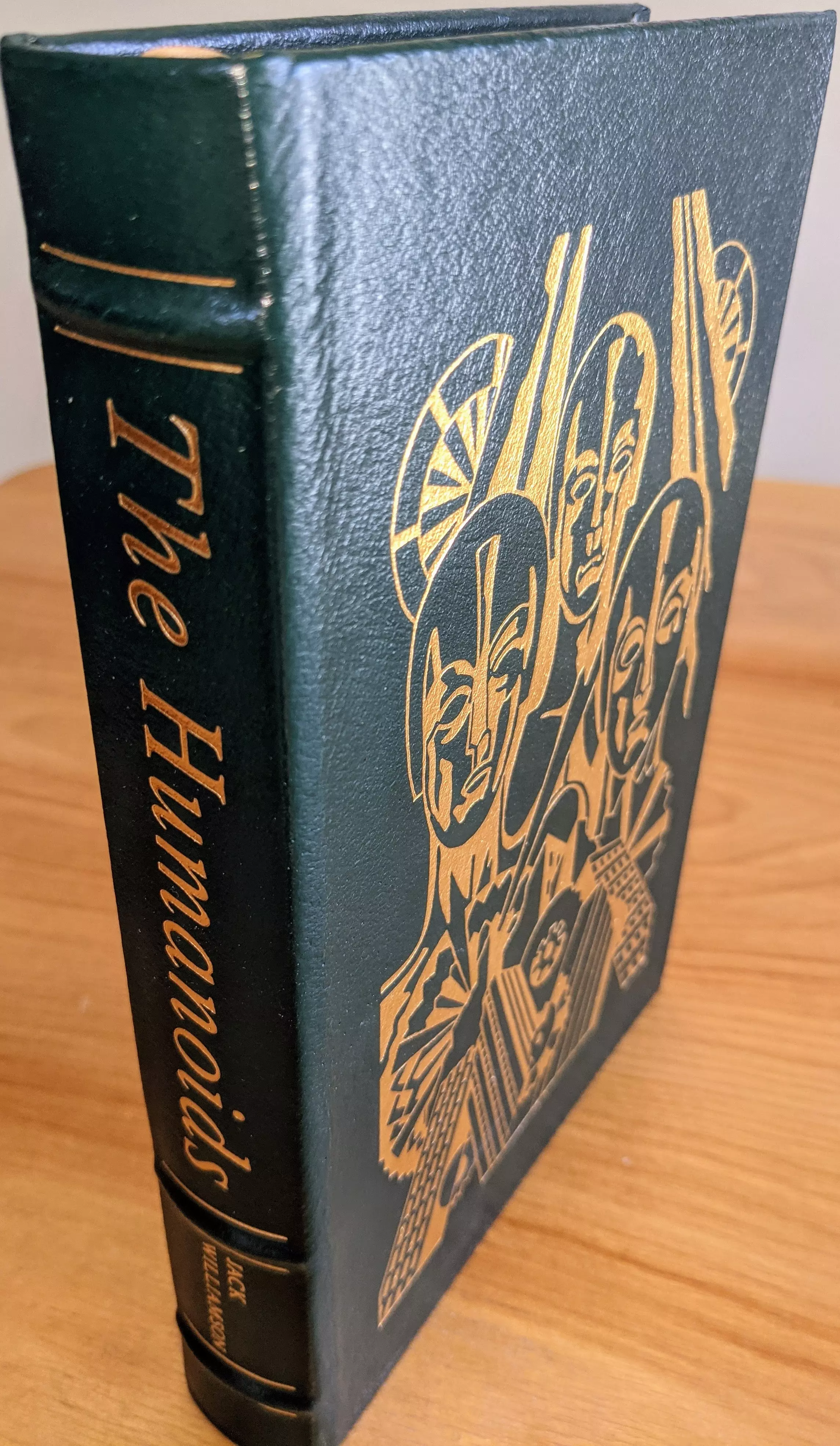 Stunning Green Leather Bound hardback book with hubbed spine, cover artwork in 22kt gold, printed on archival paper with gold gilded edges, smyth sewing & concealed muslin joints
	  - original artwork by David G. Klein