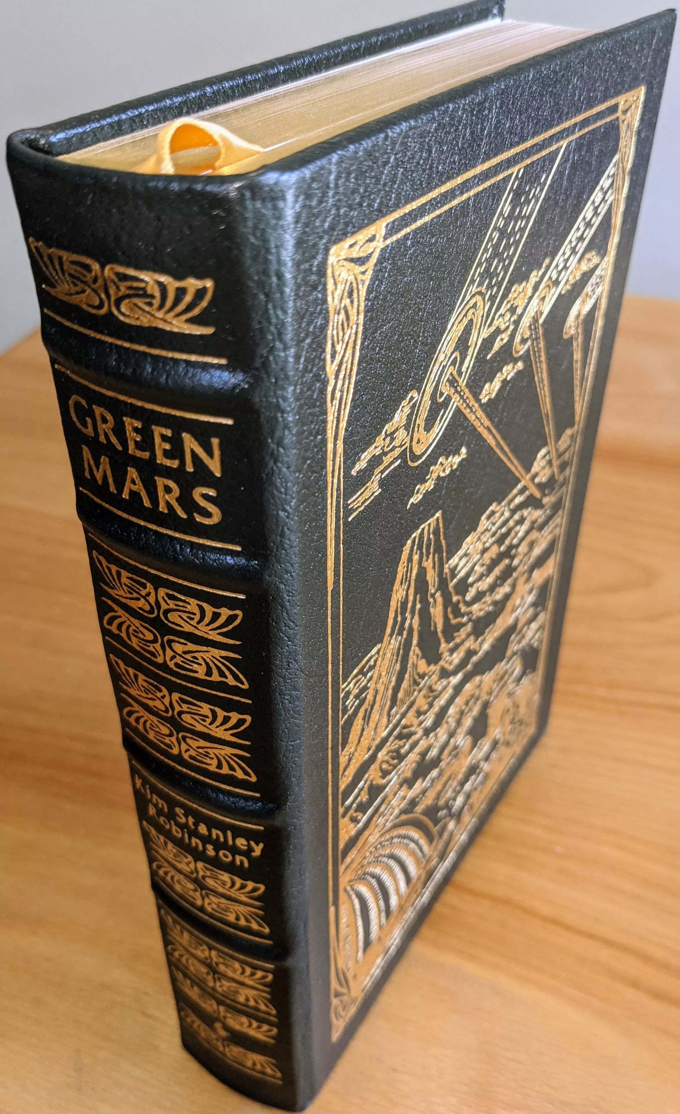 Stunning Dark Green Leather Bound hardback book with hubbed spine, cover artwork in 22kt gold, printed on archival paper with gold gilded edges, smyth sewing & concealed muslin joints
	  - original artwork by Ron Walotsky