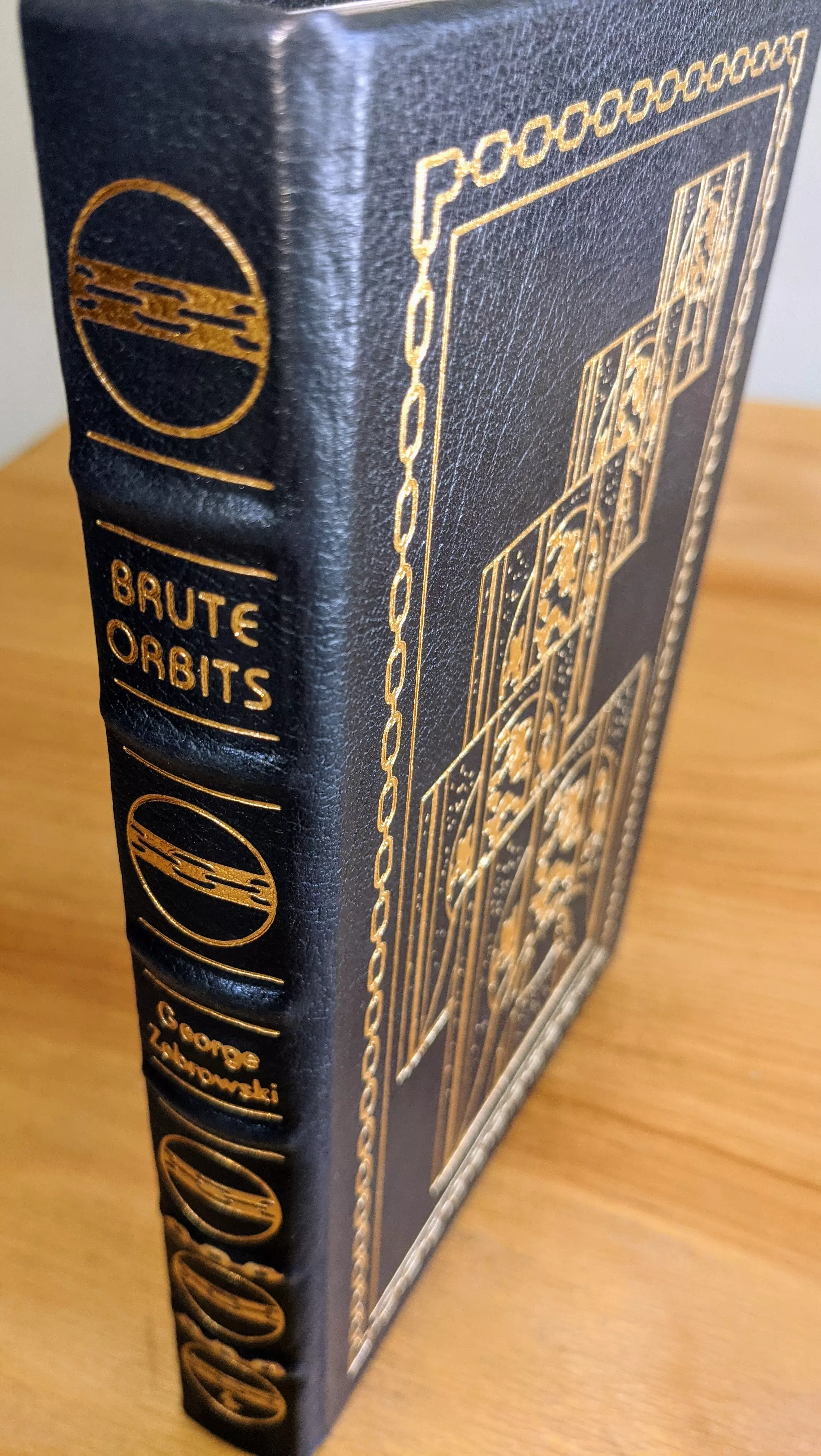 Stunning Dark Navy Blue Leather Bound hardback book with hubbed spine, cover artwork in 22kt gold, printed on archival paper with gold gilded edges, smyth sewing & concealed muslin joints
	  - original artwork by Bob Eggleton
