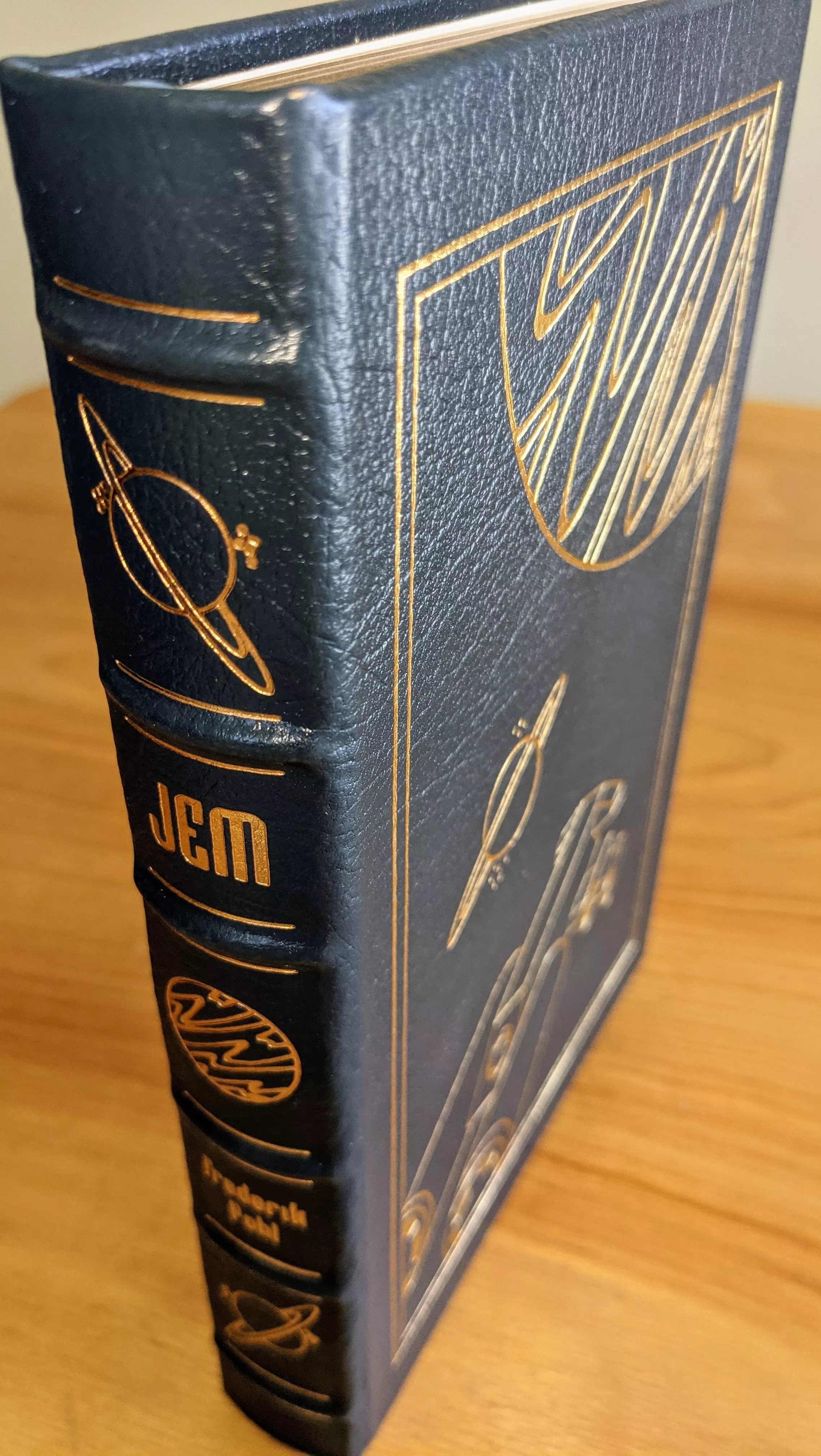 Stunning Grey Leather Bound hardback book with hubbed spine, cover artwork in 22kt gold, printed on archival paper with gold gilded edges, smyth sewing & concealed muslin joints
	  - original artwork by Vincent Di Fate