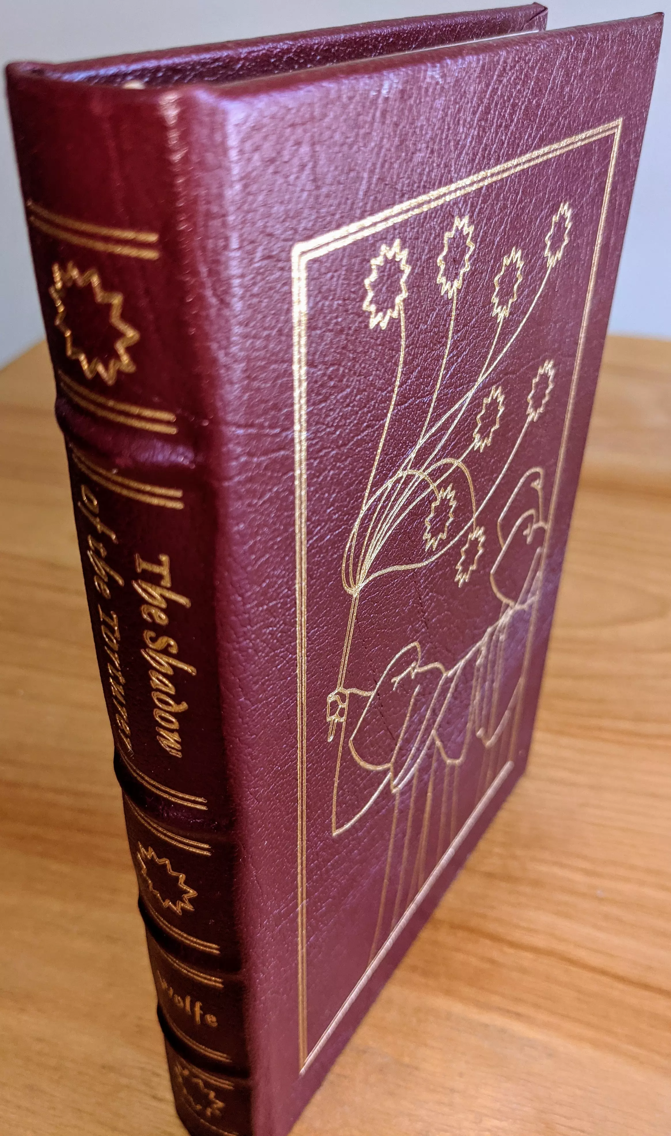 Stunning Red Leather Bound hardback book with hubbed spine, cover artwork in 22kt gold, printed on archival paper with gold gilded edges, smyth sewing & concealed muslin joints
	  - original artwork by Michael Mariano
