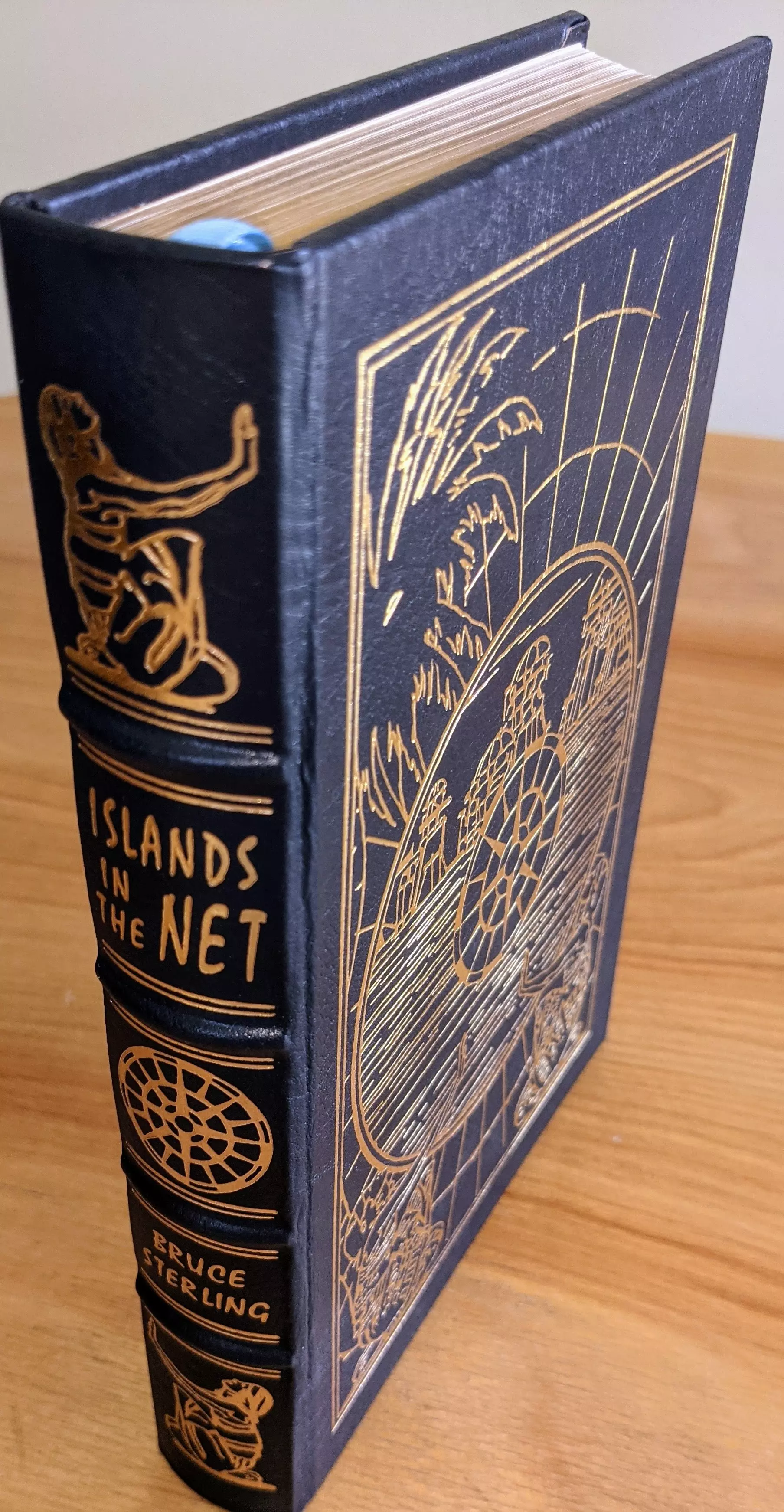 Stunning Navy Blue Leather Bound hardback book with hubbed spine, cover artwork in 22kt gold, printed on archival paper with gold gilded edges, smyth sewing & concealed muslin joints
	  - original artwork by Kent Bash